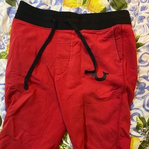 True religion red and black shorts